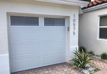 Wide view of new double grey sectional garage door after installation on a Citrus Heights, CA home.